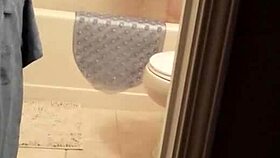 shy girl steps into steamy shower for intimate bathing moment