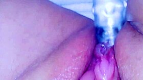 curious asian coed squirts huge on glass toy dildo