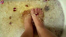 barefoot beauty washes feet with rose petals after long day