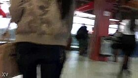 woman in jacket and boots rides train candidly