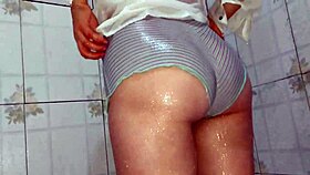 married woman in wet t-shirt enjoys shower intimacy