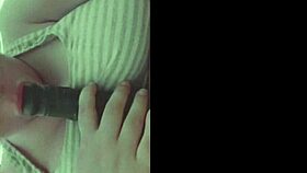 she grabs her dildo slides it between those huge saggy tits in homemade fun