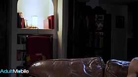 Classy brunette spreads legs on sofa, ready for huge cock in shaved pussy?