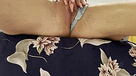 a woman rubs her sensitive spot to an explosive climax in close-up view on bed