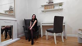 evelyn models teasing in black pantyhose and tight tshirt