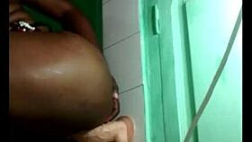 black gymnast fixes wall dildo for acrobatic lesbian toy play session