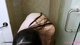 A bold brunette queen steps into the shower casually.