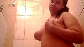 Watch this chubby latina's big ass pussy tease in steamy bath