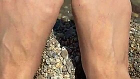 Curvy Asian beauty flaunts feet and soles on sunny beach