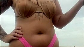 Begging him to whip out hard cock from shorts on beach