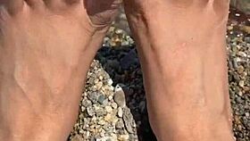 Curvy Asian beauty flaunts feet and soles on sunny beach