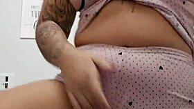 sexy redhead bares her perky tits and tight pink slit for viewers