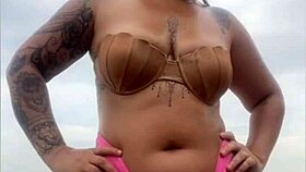 Begging him to whip out hard cock from shorts on beach