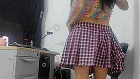 Pretty girl in miniskirt fishnets rides huge horse dildo