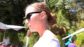 Two brunettes kiss passionately by pool fingering wet pussies outdoors