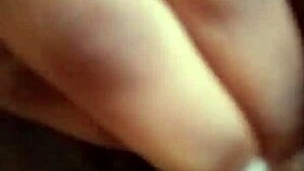 She spreads her wet ebony pussy wide fingering deeply in solo play on bed