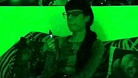 Beth's Kinky Goth Domina Smokes Hot in Green Light!