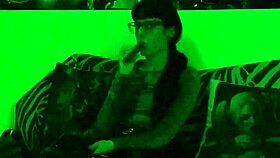 Beth's Kinky Goth Domina Smokes Hot in Green Light!