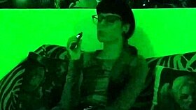 Beth's Kinky Goth Domina Smokes Hot in Green Light!